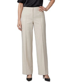 A model wearing a pair of high-waisted, wide-leg trousers in a light beige color, paired with a black top and black heels, shown against a plain white background.