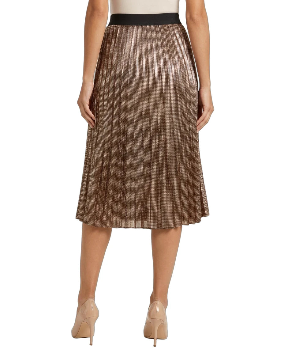 A metallic bronze pleated midi skirt with a black waistband, shown on a model from the waist down wearing beige high heels against a white background.