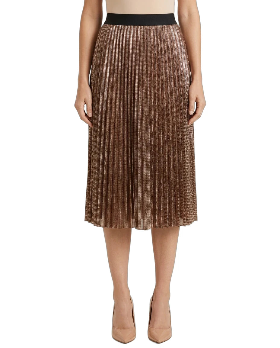 A model wearing a metallic bronze pleated midi skirt with a black waistband, paired with beige heels, shown against a plain white background.