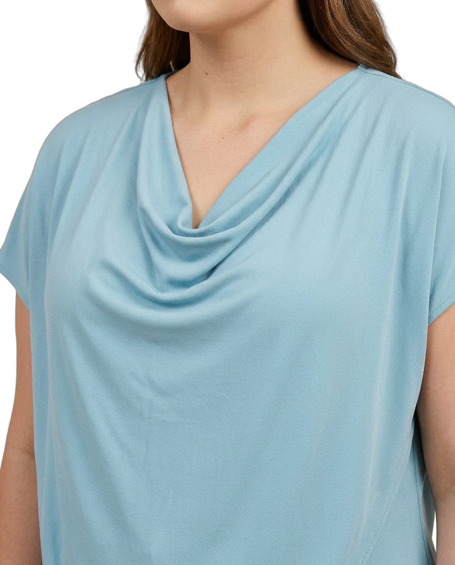 Light blue cowl-neck top worn by a person on a white background