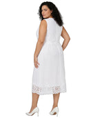 A woman modeling a sleeveless white midi dress with a textured eyelet pattern and lace trim, shown from the back against a plain white background.