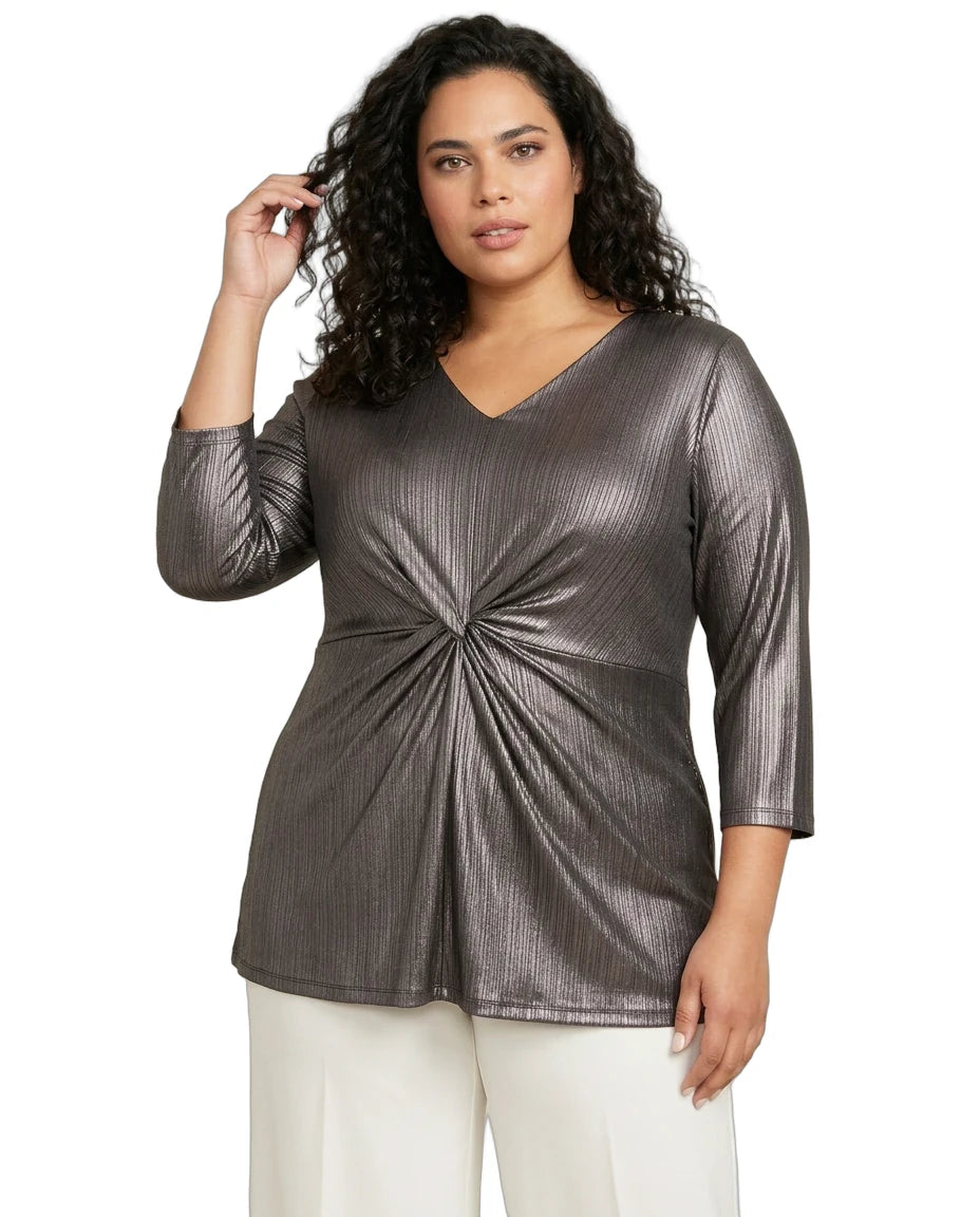 Woman wearing a metallic gray top with a knot detail on a white background