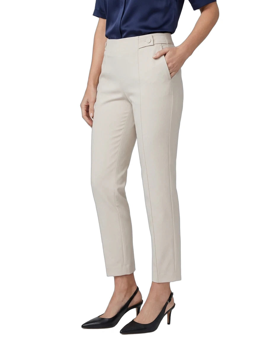 A model wearing high-waisted, straight-leg cropped trousers in a light beige color, paired with a navy blue top and black slingback heels, shown against a plain white background.