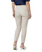 A model shown from the back wearing high-waisted, light beige cropped trousers, a navy blue top, and white slingback heels against a plain white background.