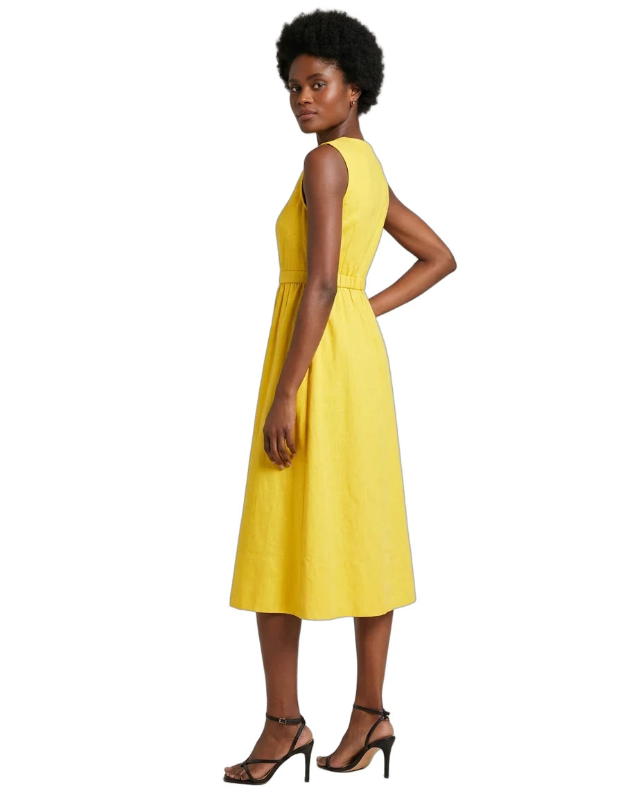 A woman modeling a sleeveless yellow midi dress with a fitted waist and flared skirt, shown from the back against a plain white background.