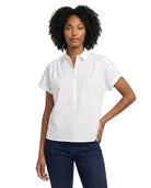 Woman wearing a white short-sleeve blouse on a white background