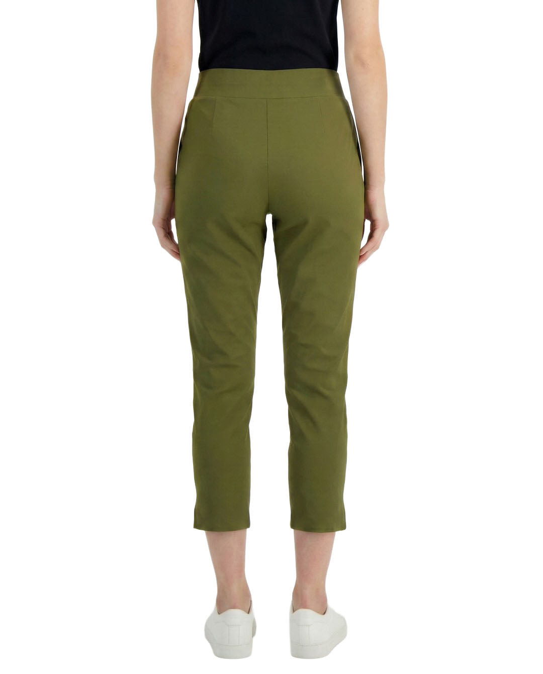 Person wearing olive green pants on a white background