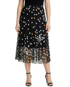Black skirt with white and yellow polka dots on a white background