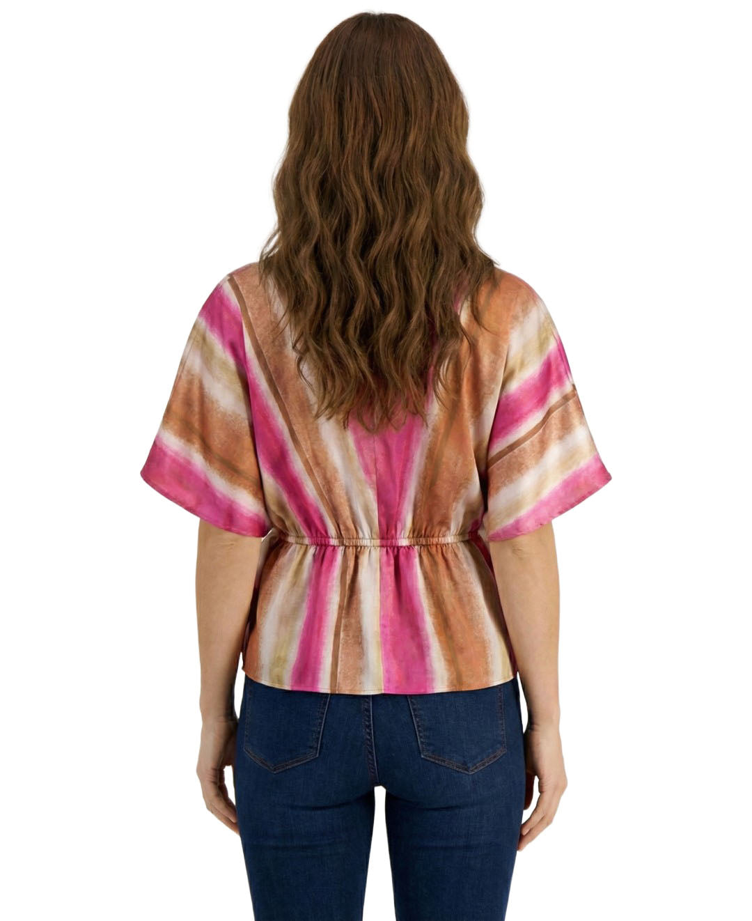 Woman wearing a colorful striped shirt and blue jeans on a white background