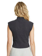 Person wearing a dark gray sleeveless top on a white background