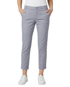 Person wearing light purple pants on a white background