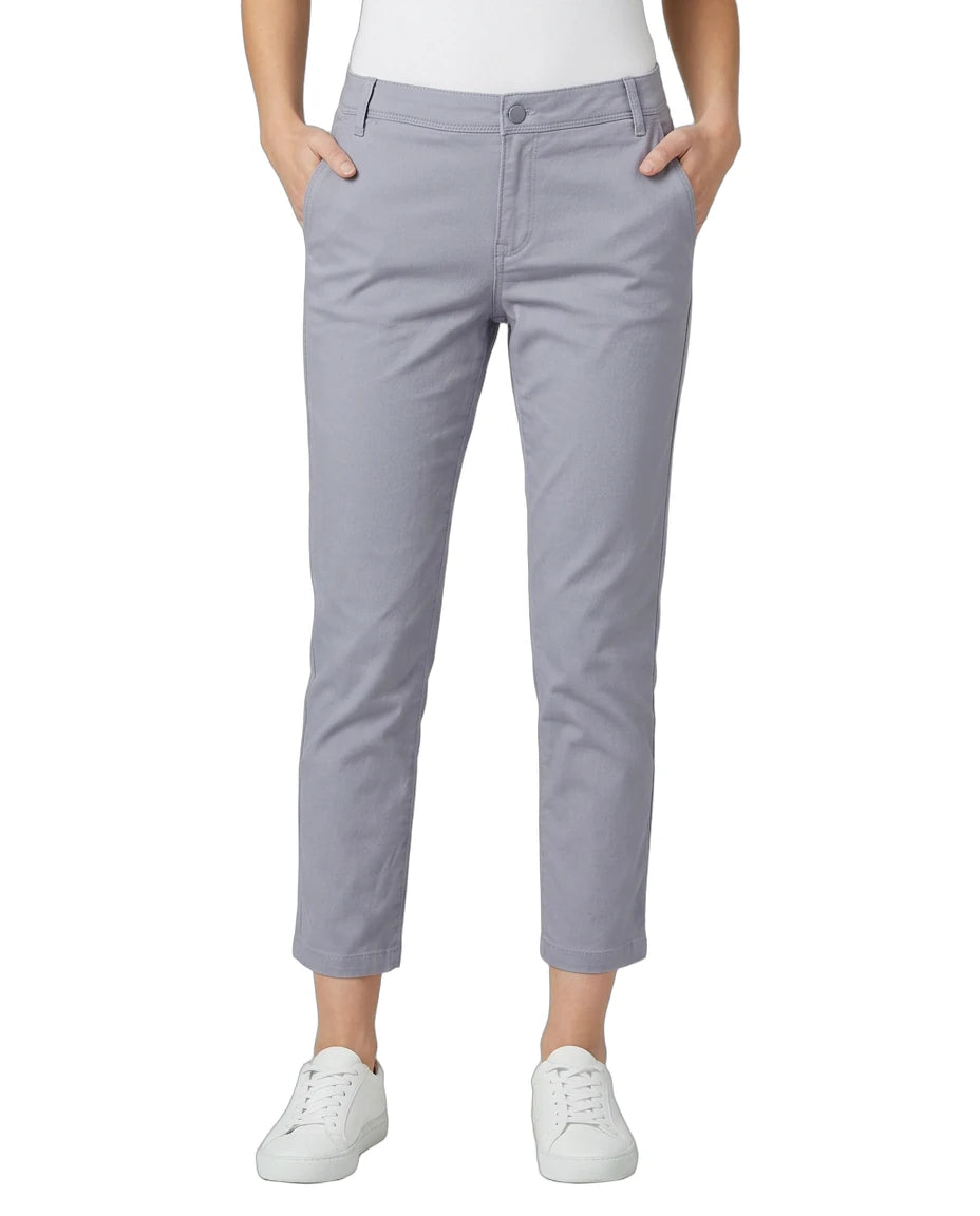 Person wearing light purple pants on a white background