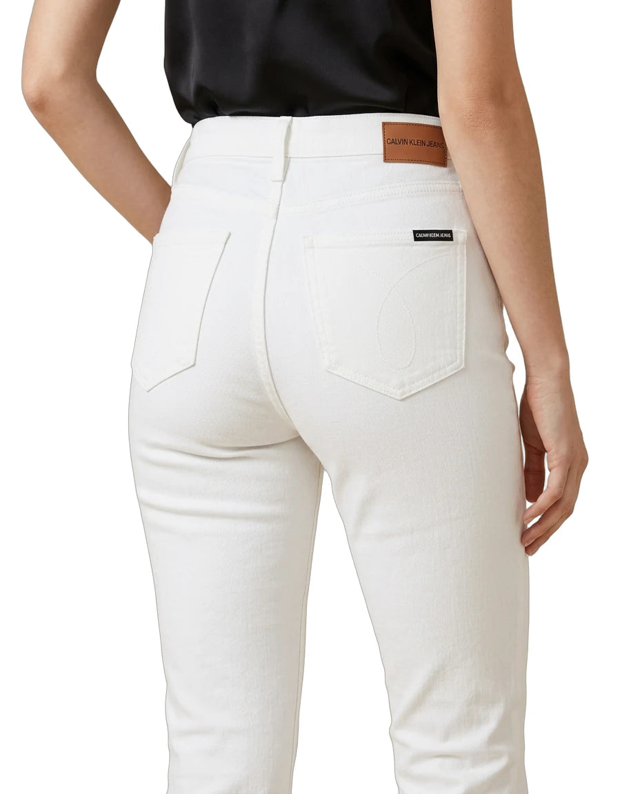 White jeans with a brand label on a white background