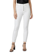 White jeans worn by a person on a white background