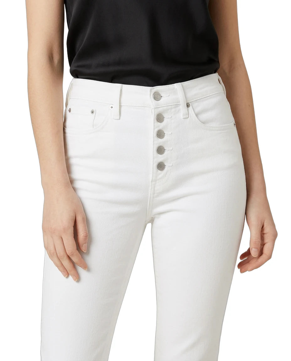 White jeans with button fly worn by a person on a white background