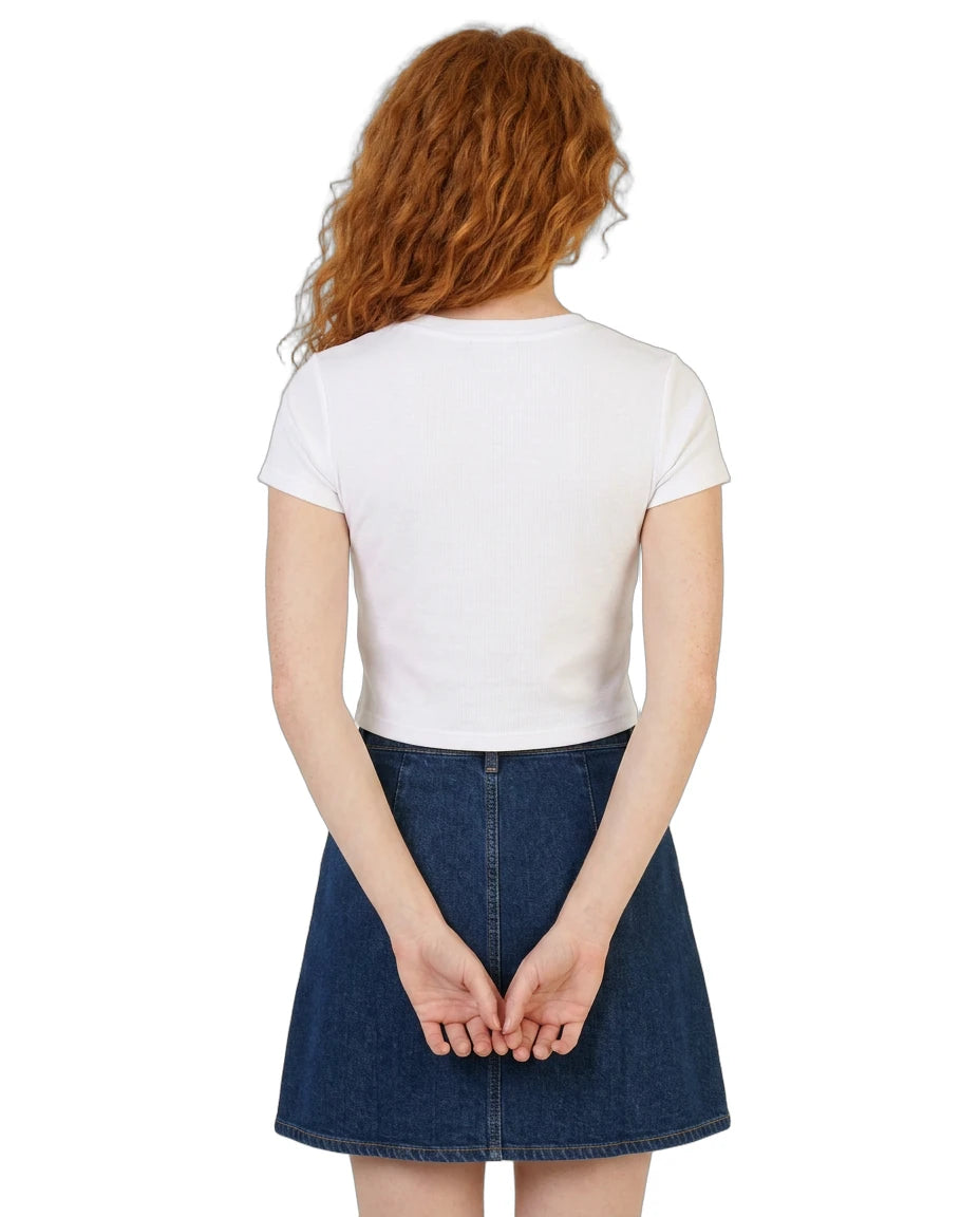 Person wearing a white t-shirt and blue denim skirt on a white background