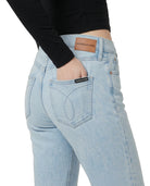 Light blue jeans with a Calvin Klein label on a white background