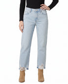 Light blue jeans worn by a person on a white background