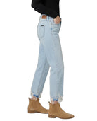 Light blue jeans worn by a person on a white background