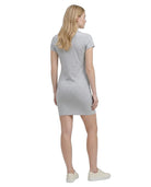 Woman wearing a gray Calvin Klein t-shirt dress on a white background