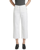 Person wearing white wide-leg jeans on a white background