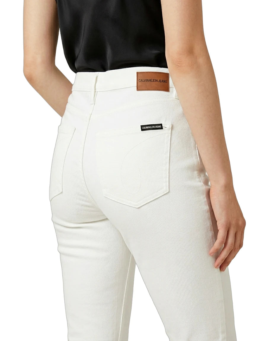 White jeans with a brand label on a white background