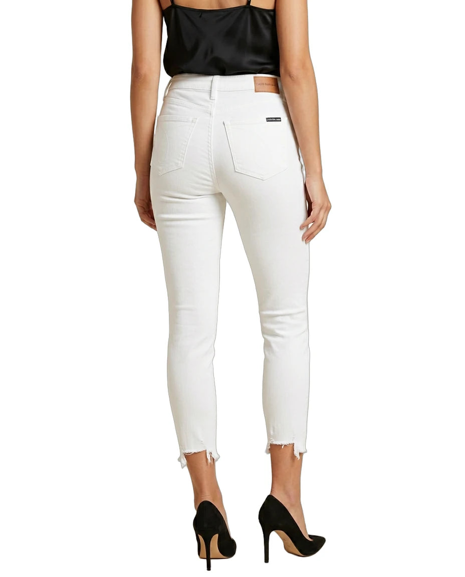 Person wearing white pants and black top on a white background