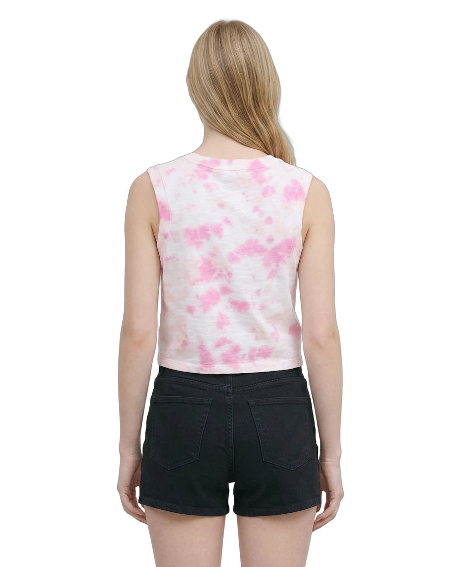 Woman wearing a sleeveless top with pink floral pattern and black shorts on a white background