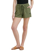 Person wearing green shorts on a white background