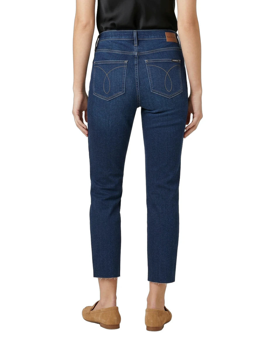 Person wearing blue jeans on a white background