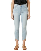 Light blue jeans worn by a person on a white background