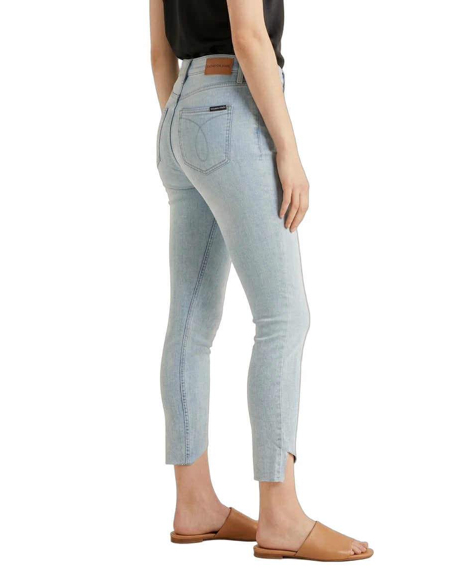 Light blue jeans worn by a person on a white background