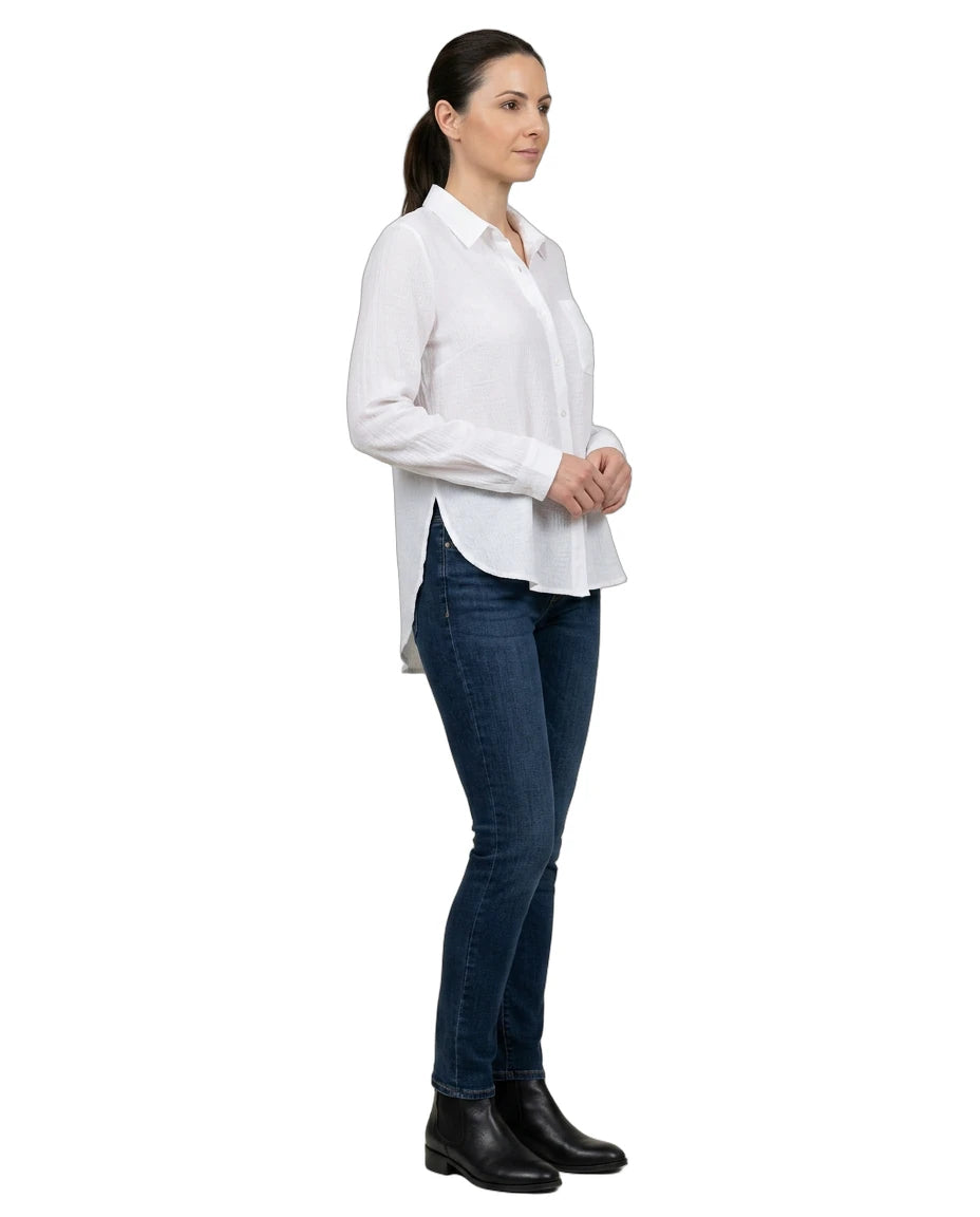 Woman wearing a white shirt and blue jeans on a white background