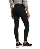 Person wearing black Calvin Klein leggings with brand logo on a white background