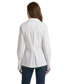 Woman wearing a Calvin Klein white blazer on a white background