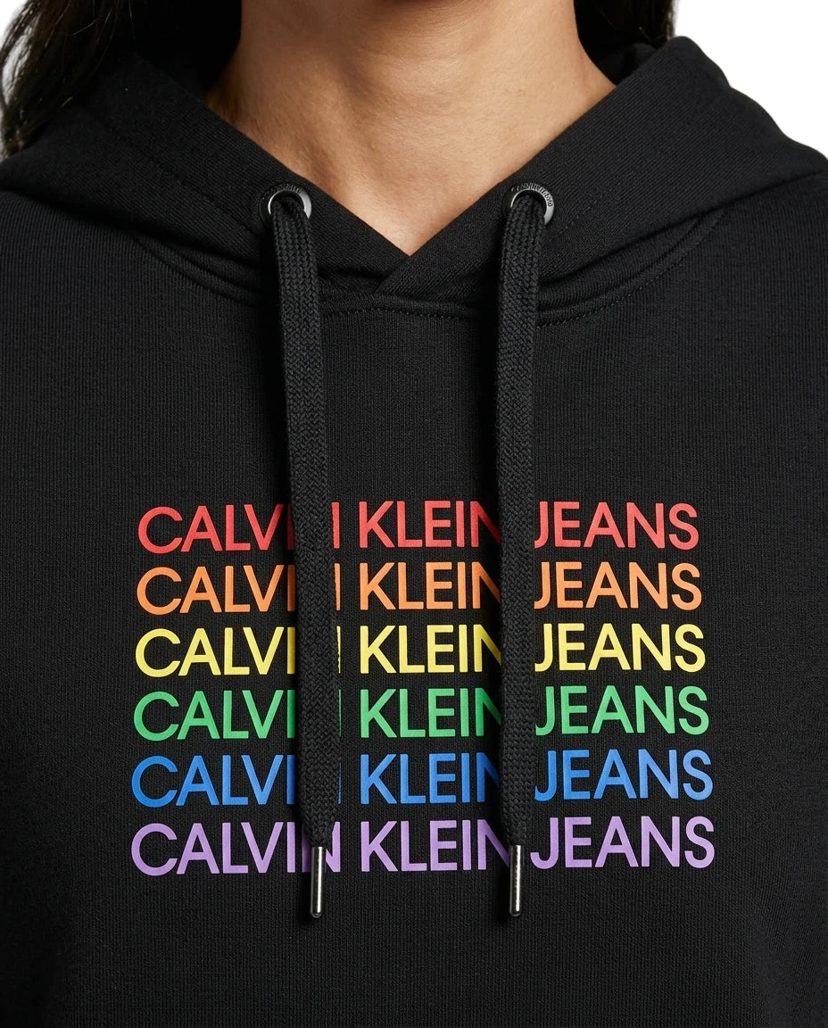 close up of the logo on a black Calvin Klein hoodie with colorful text design on a white background