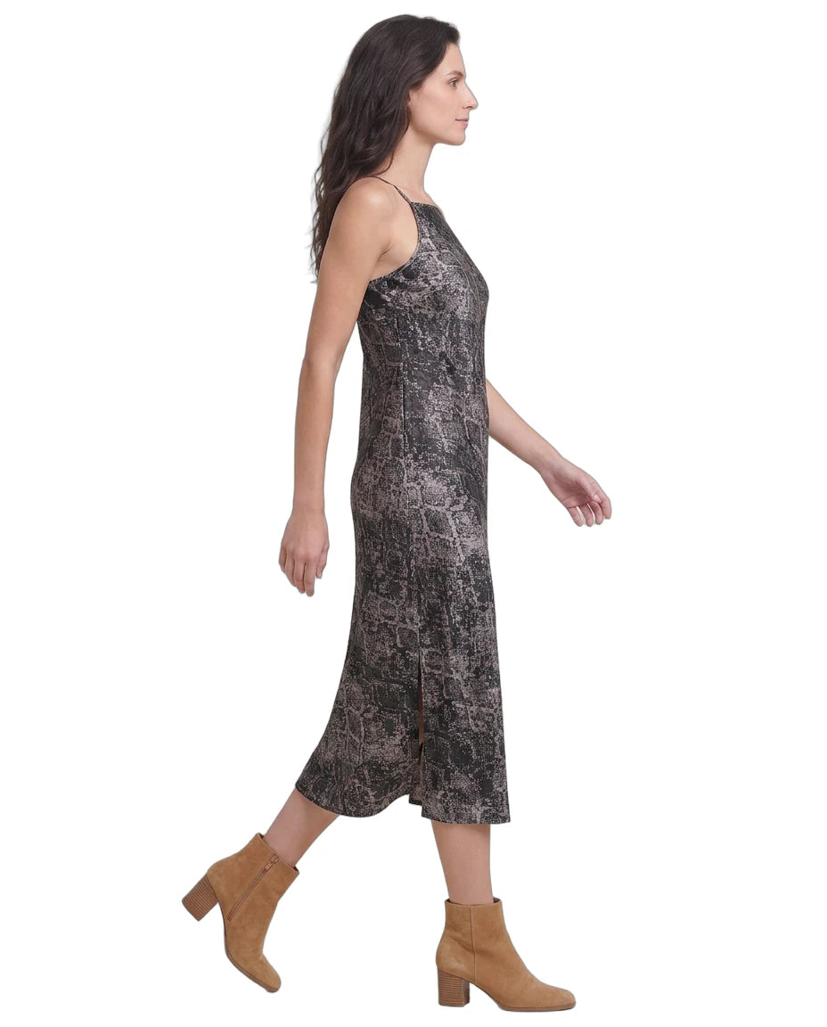 Woman wearing a patterned Calvin Klein dress on a white background