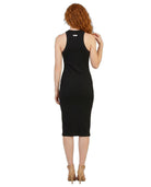 Woman wearing a black sleeveless Calvin Klein dress on a white background