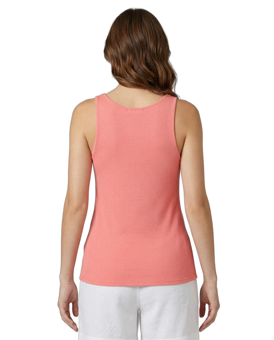 Woman wearing a coral Calvin Klein tank top on a white background