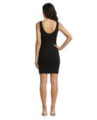 Woman wearing a black sleeveless Calvin Klein dress on a white background