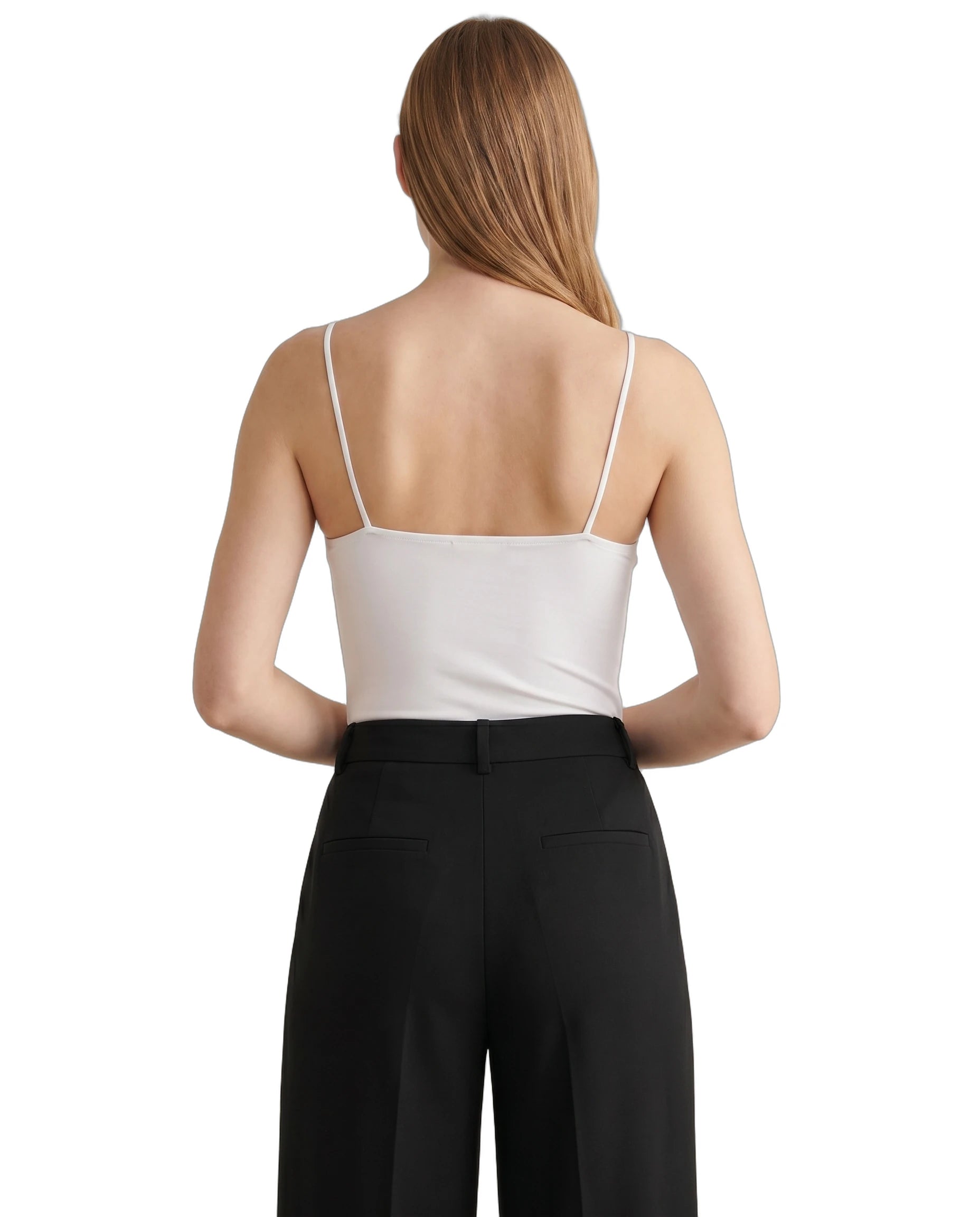 Person wearing a white Calvin Klein bodysuit and black pants on a white background