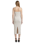 Woman wearing a white Calvin Klein dress on a white background