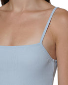 Light blue Calvin Klein dress worn by a person on a white background