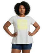 Woman wearing a Calvin Klein t-shirt with a yellow logo on a white background