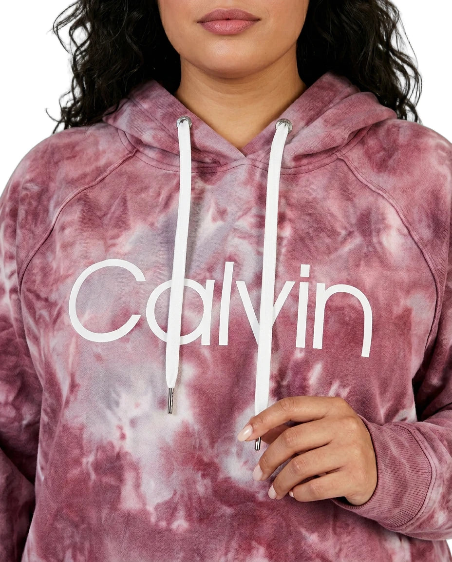 Person wearing a pink tie-dye hoodie with 'Calvin' branding