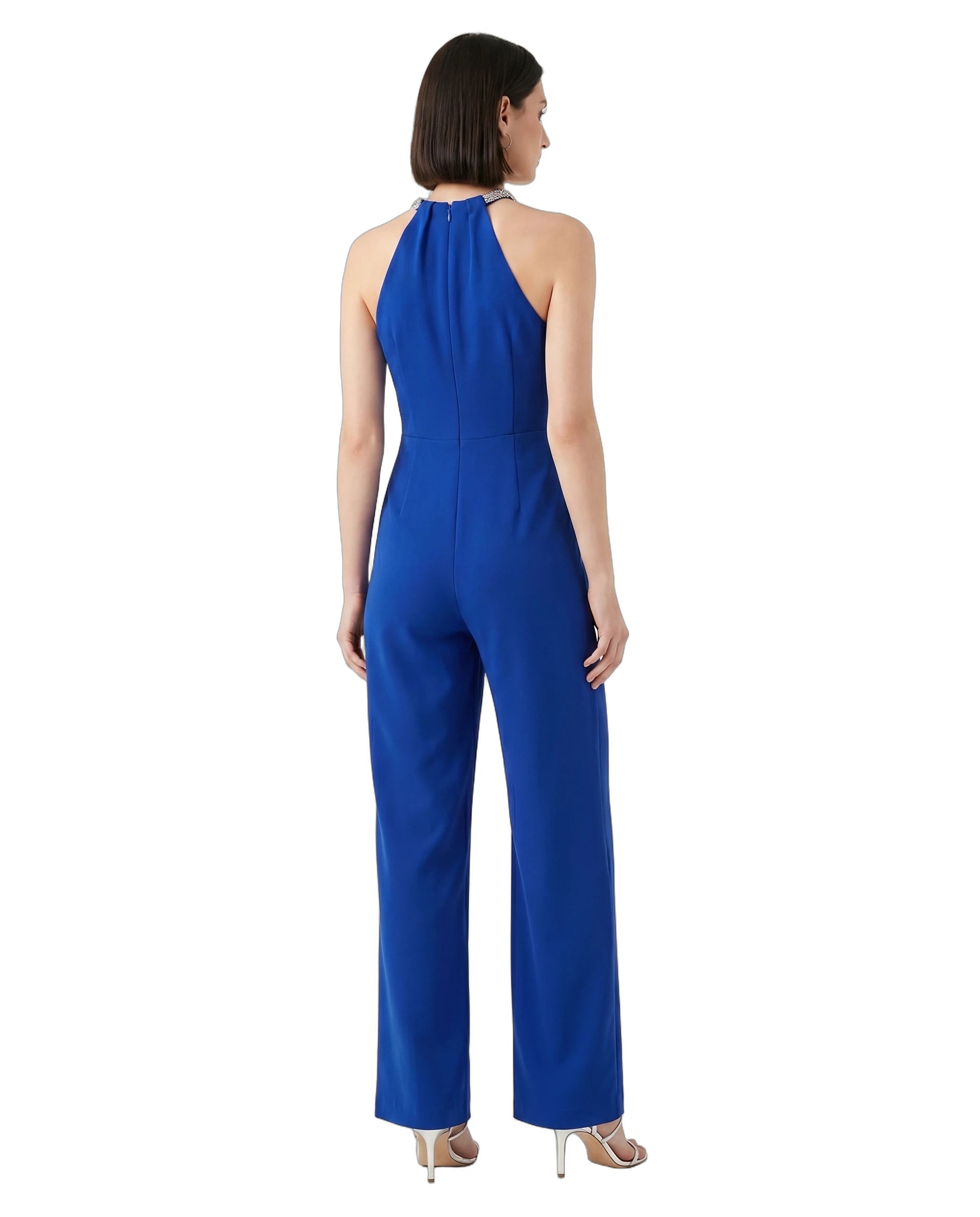Woman wearing a blue jumpsuit on a white background