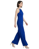 Woman wearing a blue jumpsuit on a white background