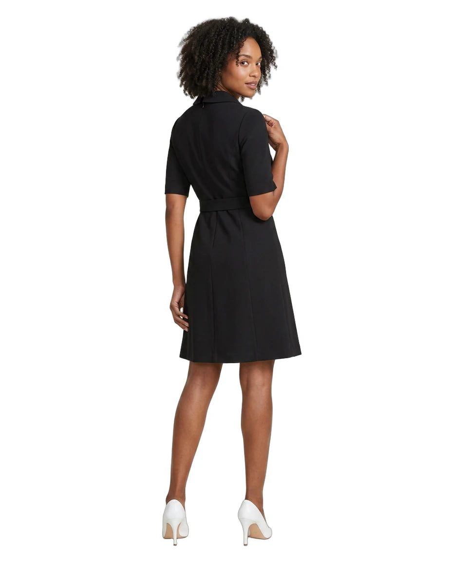Woman wearing a black dress on a white background