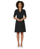 Woman wearing a black dress with a belt on a white background