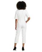 Person wearing a white jumpsuit on a white background